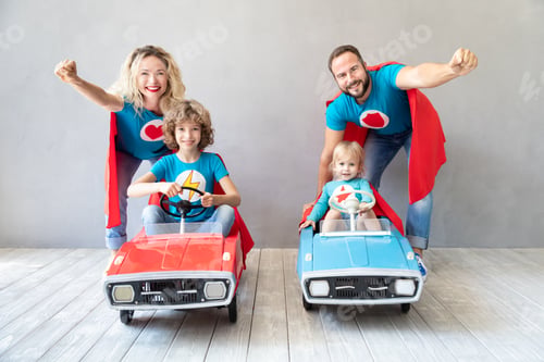 Preview: Family of superheroes playing at home