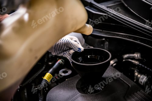 Preview: Close-up of oil change in a car during service