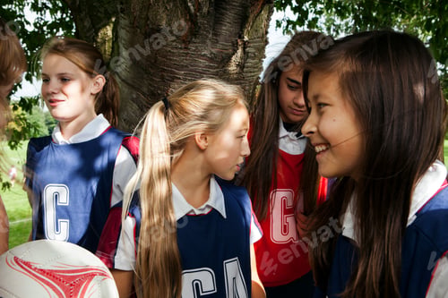 Preview: Teenage schoolgirl netball team in break