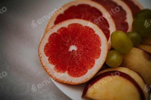 Preview: Closeup shot of tasty fresh cut fruits on the plate