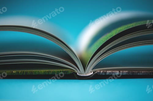 Preview: An open book of a photo album standing on the table