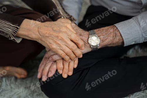 Preview: Elderly Couple Holding Hands with Love and Tenderness
