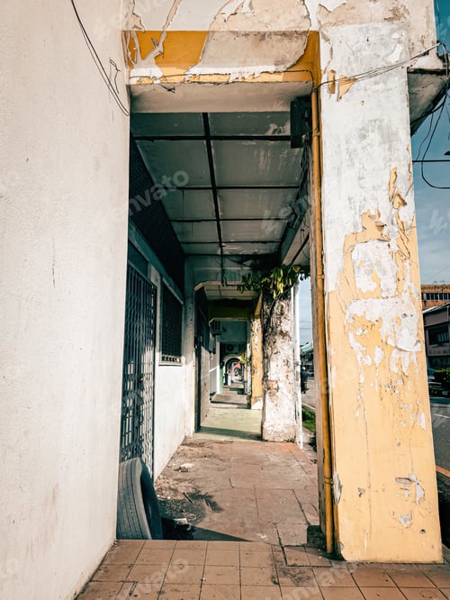 Preview: Vintage arches of a sidewalk alley lined with old shops in Kuala Pilah old town