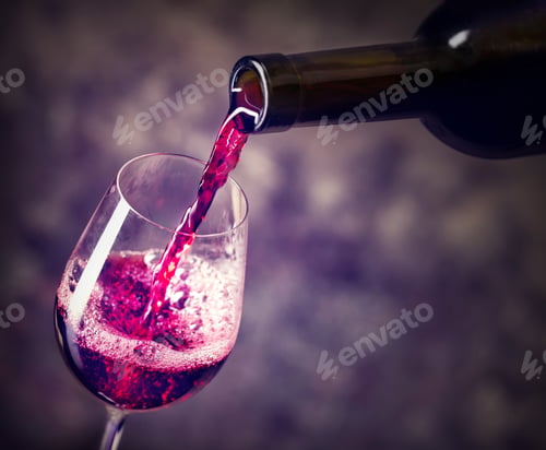 Preview: Red wine is the being poured into glass
