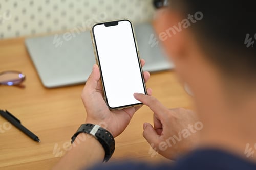 Preview: Man hands using smartphone at workplace. Blank screen for your advertising text message