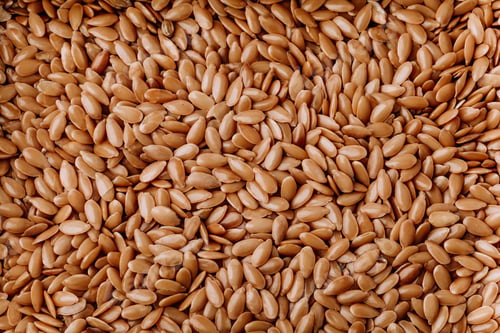 Preview: Many flax seeds as background, vegetarian and healthy diet.