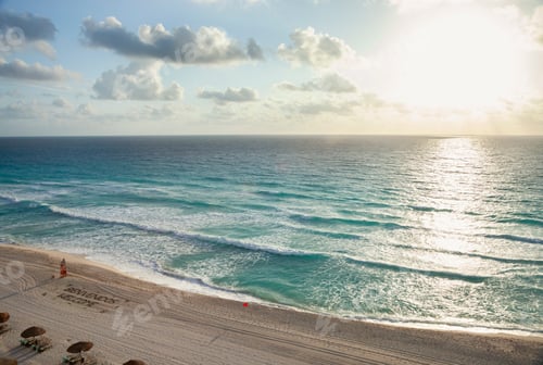 Preview: High angle view of sunrise over the ocean and beach in Cancun