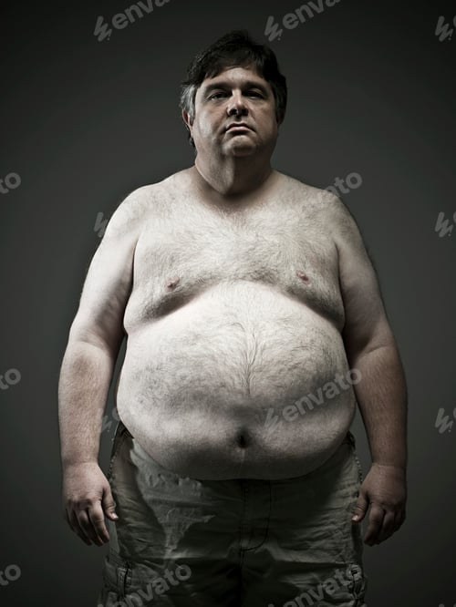 Preview: Serious man standing against a dark background