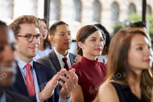 Preview: Audience applauding at a business seminar, close up