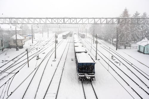 Preview: Train station with railways covered by snow in winter time