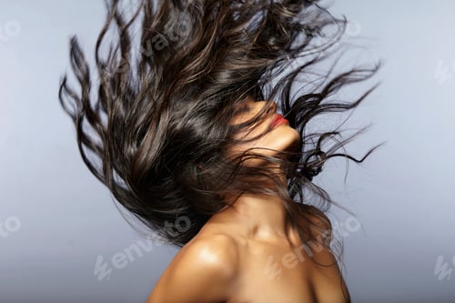 Preview: Female model throwing hair back