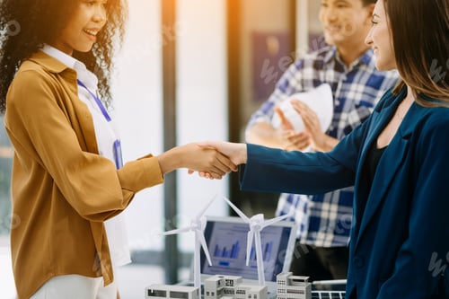 Preview: business people shaking hands during a meeting in office