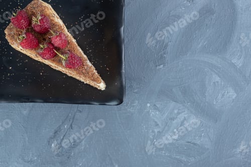Preview: Platter with a strawberry topped cake slice on marble background