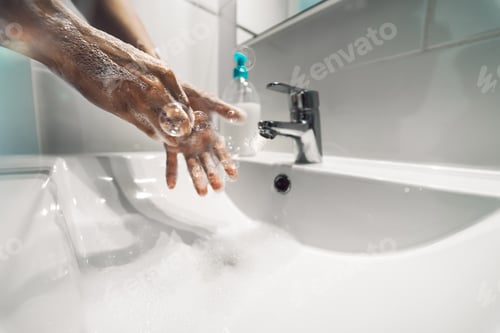 Preview: Female washing hands with liquid soap for preventing and stop corona virus spreading