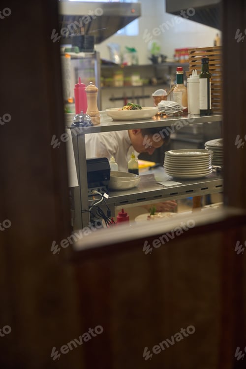 Preview: Man is at his workplace in a restaurant kitchen