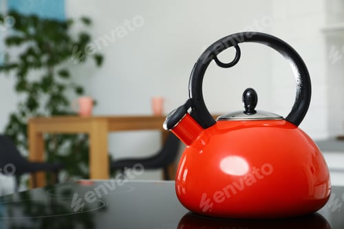 Preview: Modern kettle with whistle on stove in kitchen, space for text