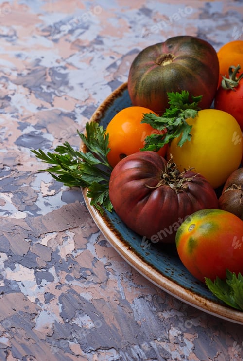 Preview: Different sort of tomato on concrete background