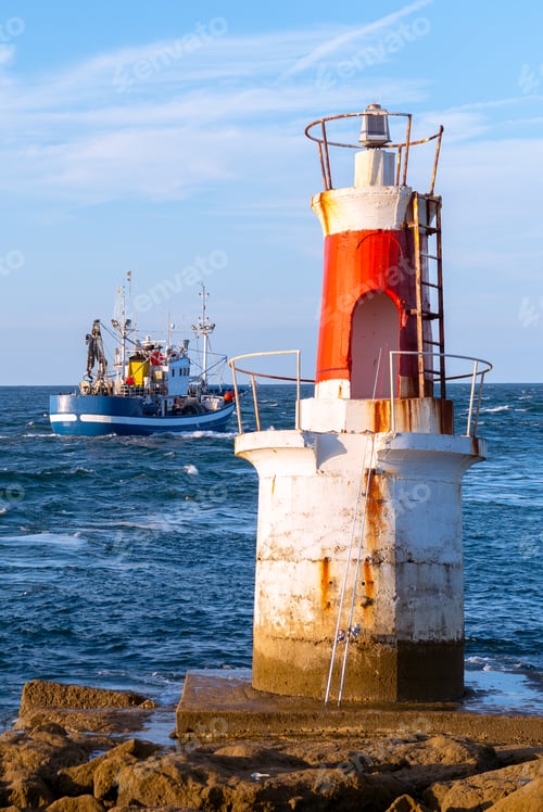 Preview: Lighthouse on rocky coastline