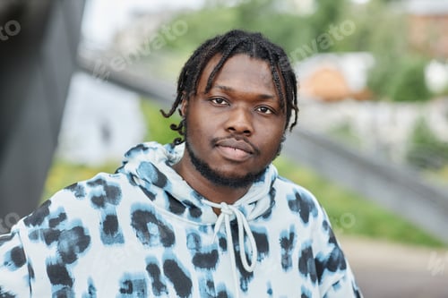 Preview: Black man wearing hoodie outdoors