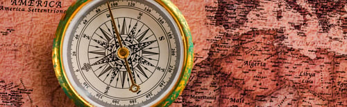 Preview: panoramic shot of golden compass near map