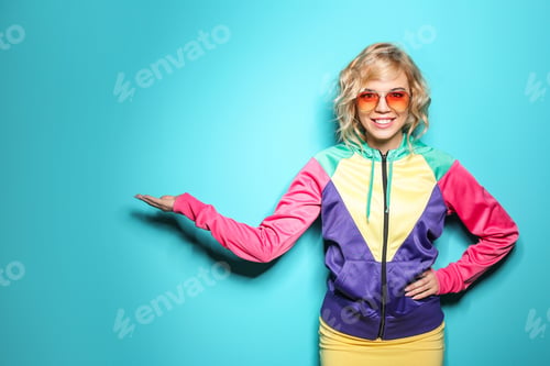 Preview: Stylish young woman posing on color background