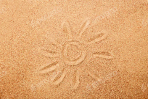 Preview: The sun is painted on the sand. Sand texture, natural background.