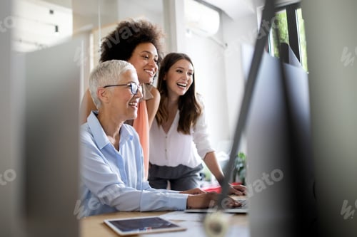Preview: Group of successful business people at work in office