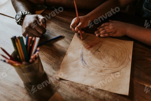 Preview: Daughter drawing with dad at a restaurant