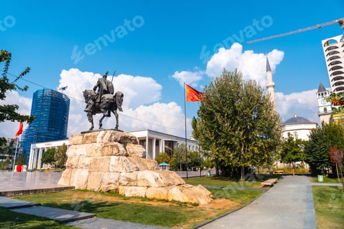 Preview: Skanderbeg horse monument at Skanderbeg Square in Tirana and the red flag of Albania