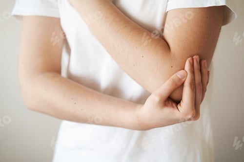 Preview: Elbow injury trauma. Young woman with arm pain and bruising from accident