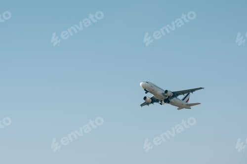 Preview: Commercial jet plane landing in blue sky