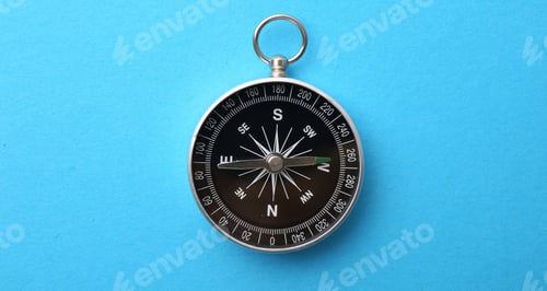 Preview: One compass on light blue background, top view