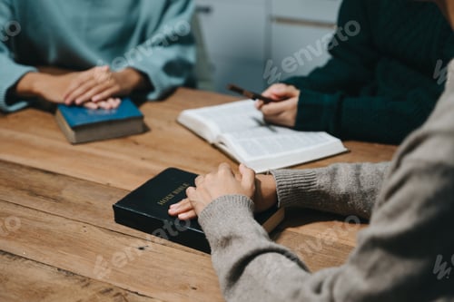 Preview: People reading and study bible in home and pray together.Studying the Word Of God