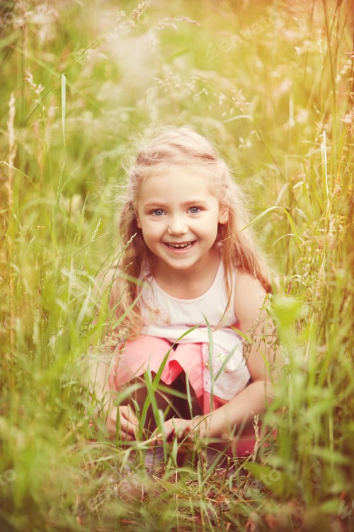 Preview: Little girl hiding in high grass