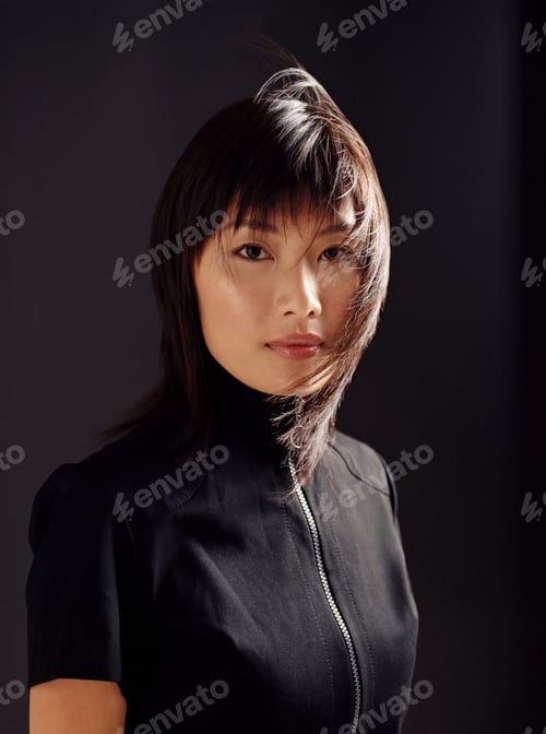 Preview: Young asian woman with windswept hair