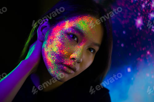 Preview: Fashion model with fluo painting on the face