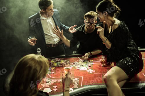 Preview: side view of group of people playing poker together in casino