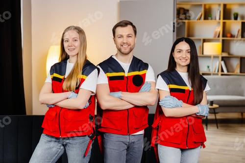 Preview: Group of people with cpr dummy looking at camera and smiling after first aid training class