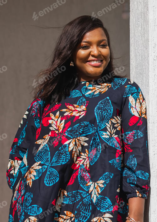 Preview: Beautiful african american woman enjoying evening on village and nature on terrace of country house
