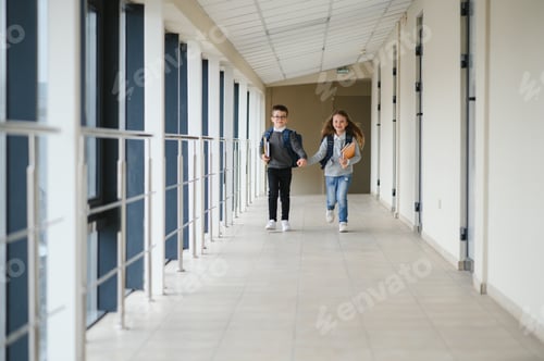 Preview: Cute pupils running down the hall at the elementary school