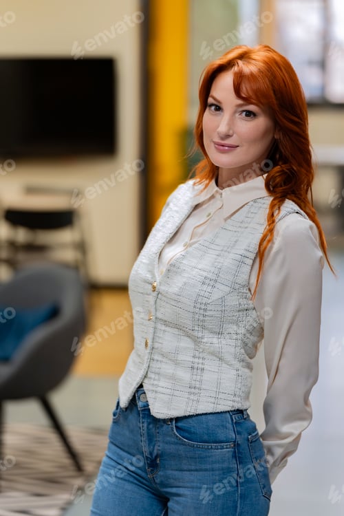 Preview: Stylish woman with red hair in smart casual attire.