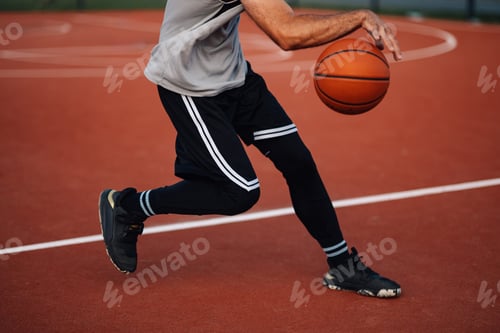 Preview: Player dribbling basketball on court