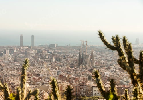 Preview: Elevated cityscape view with La Sagrada Familia and distant coast, Barcelona, Spain