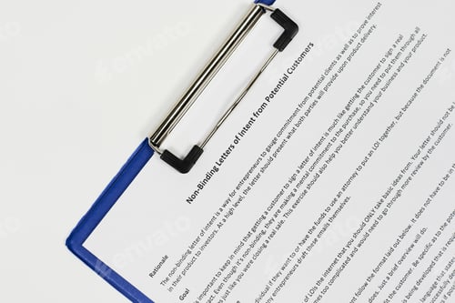 Preview: Closeup of a "Non-binding letter of intent from potential customers" on a clipboard