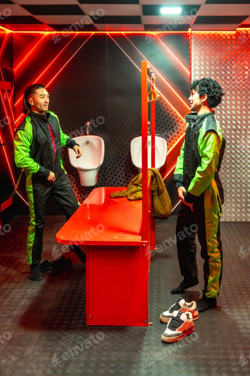 Preview: Young men changing into racing jumpsuits preparing for karting
