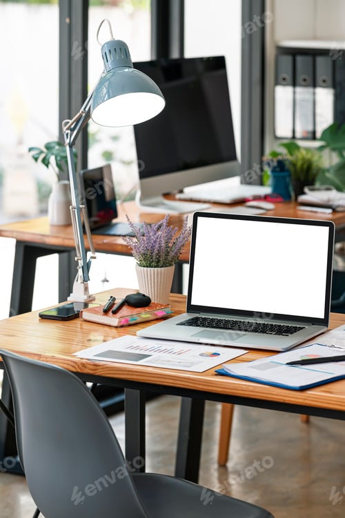 Preview: Mockup white screen portable tablet with magic keyboard on wooden table in co-workspace.