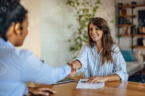 Preview: Two diverse colleagues, completing an assignement