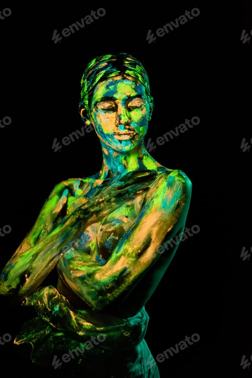 Preview: portrait of woman painted with bright neon paints on black backdrop