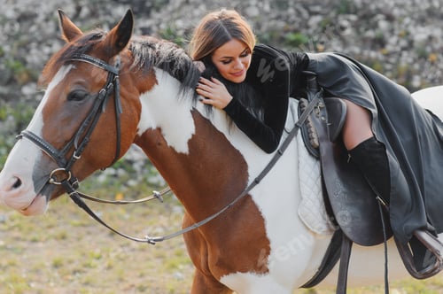 Preview: Portrait of young pretty cheerful woman with horse at summer
