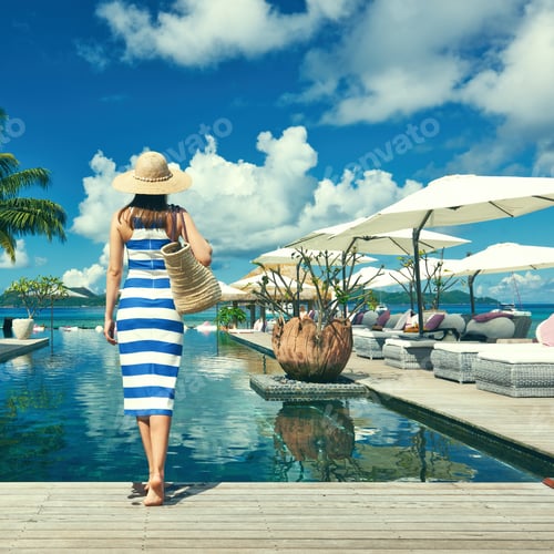 Preview: Woman In Sailor Striped Dress Near Poolside Jetty At Seychelles